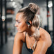 Woman wearing Wicked Audio Raen sport earbuds during a workout
