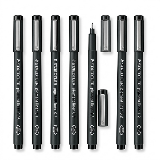 A high-resolution, centered flat lay photograph of eight Staedtler Pigment Liner technical pens, in black barrels with metallic caps, showing the range of sizes from 0.05mm to 1.2mm. All standard brand markings are visible.