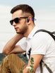 Man wearing OPN Sound Mezzo+ headphones with a backpack