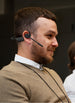 Man wearing OPN Sound Chat Pro headset in an office