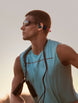 Runner wearing OPN Sound Dashlyte+ open-ear headphones outdoors