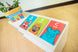 Jumbo ABC Emotion Cards displayed along a classroom ledge