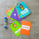 Mindful Minute cards and sand timer arranged on a wooden surface