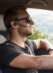 Man wearing OPN Sound Chat Pro headset while driving