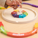 Hands placing a piece into the My Emotions Wheel puzzle