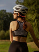 Cyclist wearing OPN Sound Dashlyte+ open-ear headphones